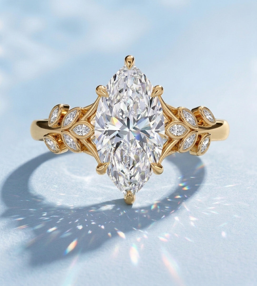 Marquise lab-grown diamond engagement ring in yellow gold with a nature-inspired leaf setting