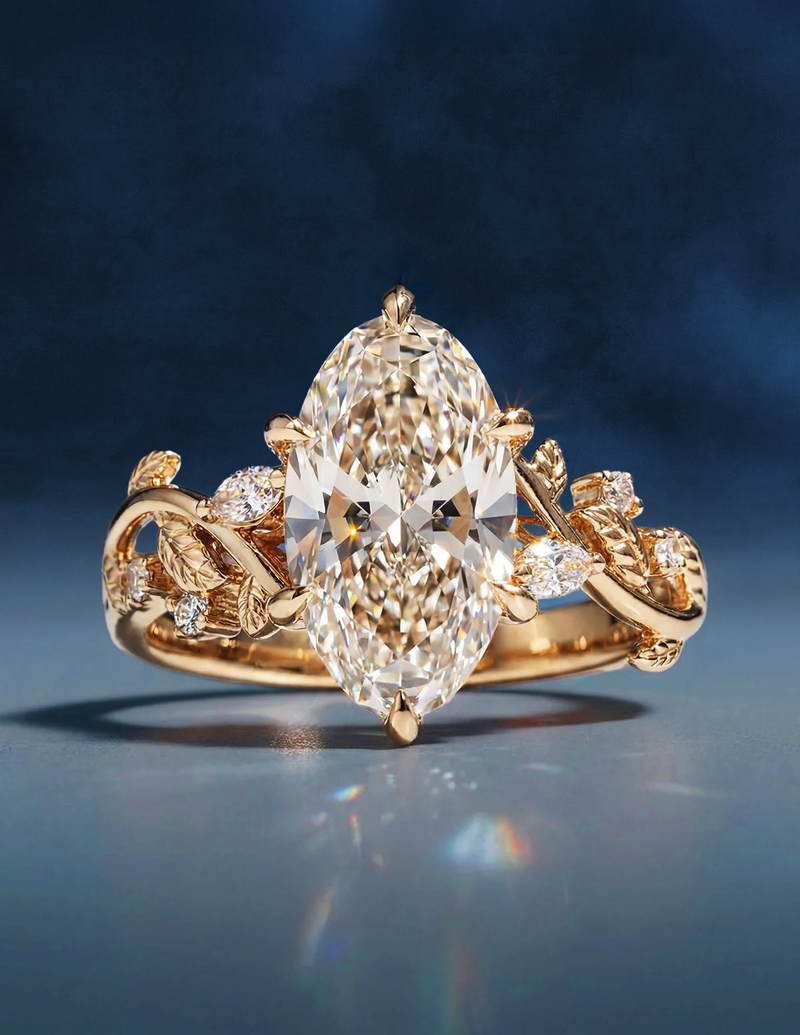 A gold ring with a large, oval diamond centerpiece on an ornate band with leaf and vine motifs, set with smaller diamonds. Background is a soft, dark blue.