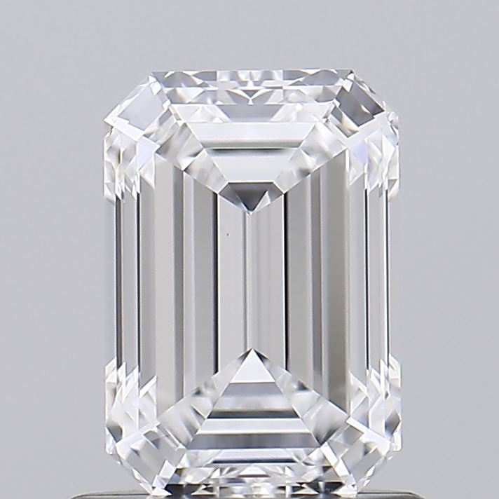 0.93 Emerald-cut diamond with sharp edges and step-like facets, reflecting light subtly against a neutral gray background, conveying elegance and luxury.