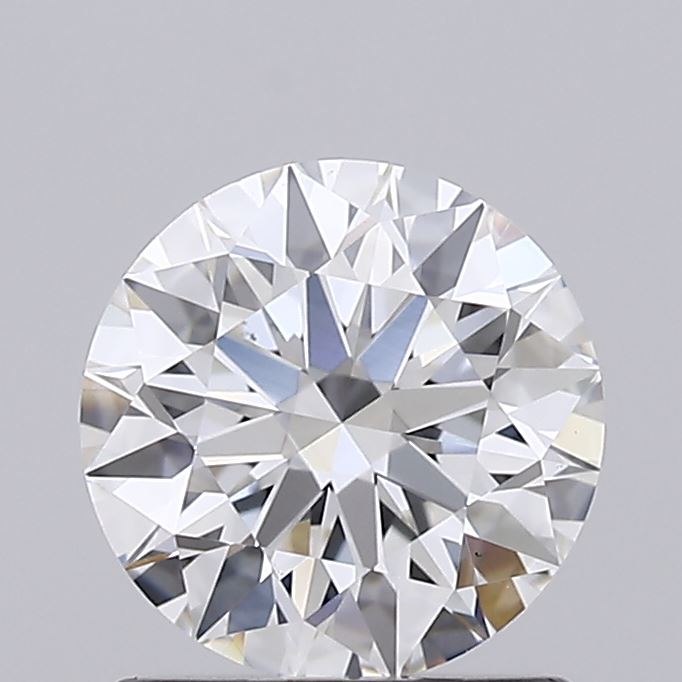 1.02 Close-up of a round, brilliant-cut diamond on a grey background. It displays intricate facets reflecting light, emphasizing its sparkle and clarity.