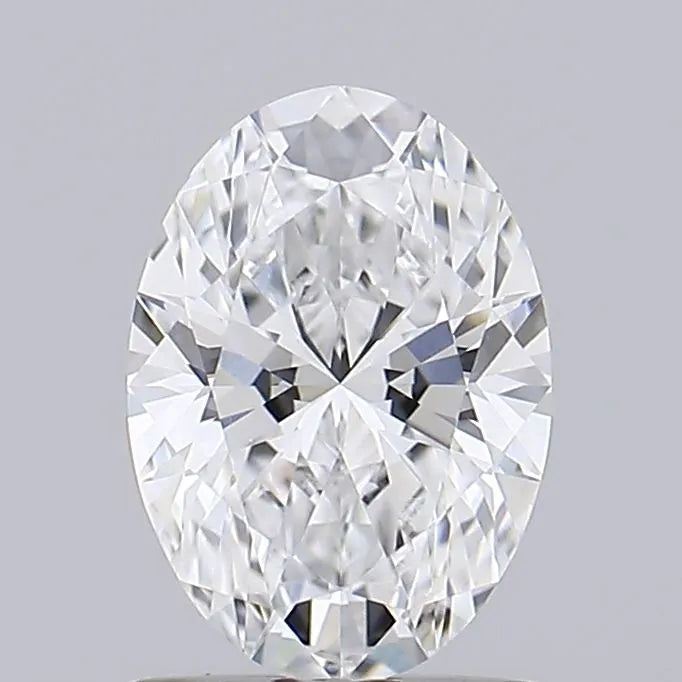 1.07 A sparkling oval cut diamond against a grey background.