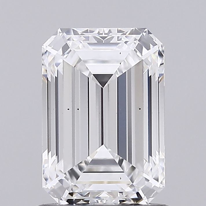 1.21 A clear, rectangular emerald-cut diamond with sharp facets and a bright sparkle set against a neutral gray background, conveying elegance and luxury.