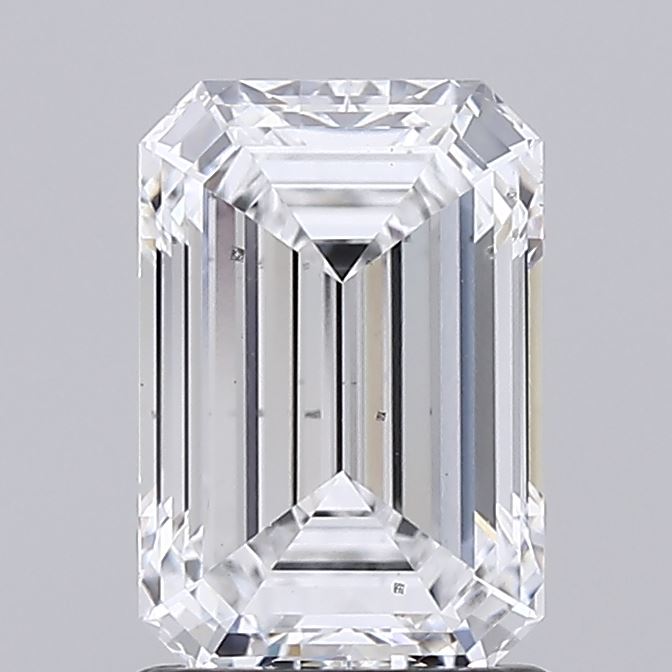 1.52 Emerald cut clear diamond with faceted edges against a grey background.