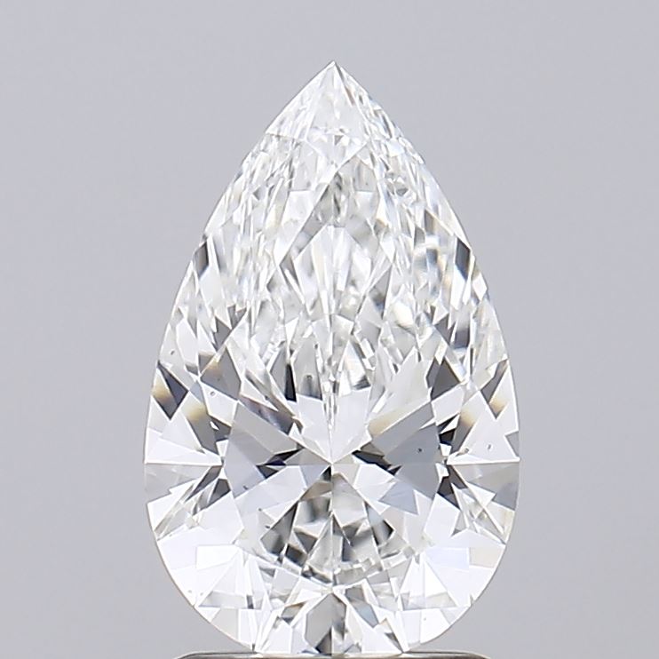 1.52 A stunning pear-shaped diamond, sharply cut and sparkling, rests on a reflective surface against a soft gray background.