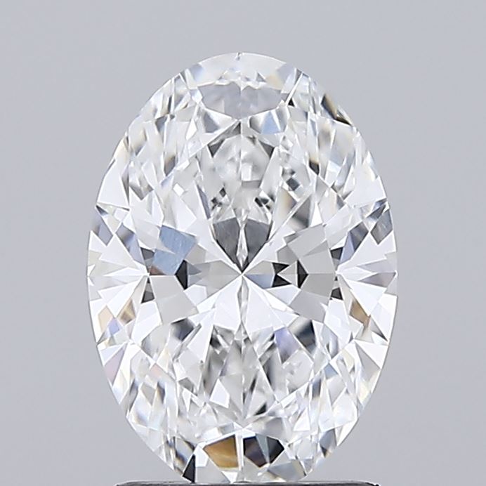 1.55 A sparkling, oval-cut diamond with intricate facets reflects light against a gray background, conveying elegance and luxury.