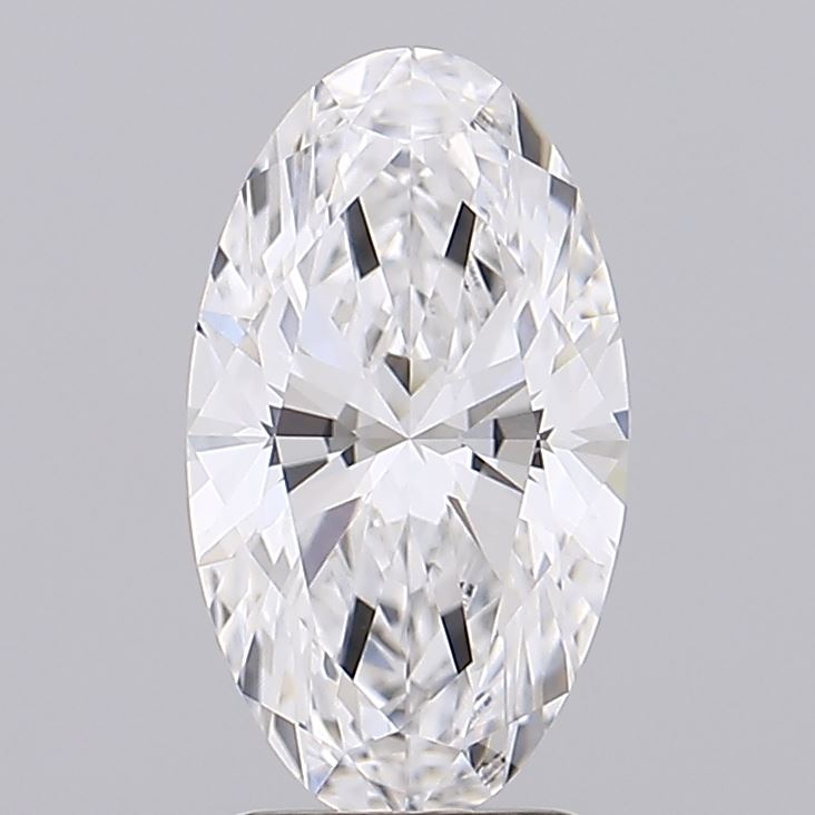 1.73 Oval-shaped, faceted diamond against a neutral gray background, displaying a brilliant cut with intricate patterns, exuding elegance and luxury.