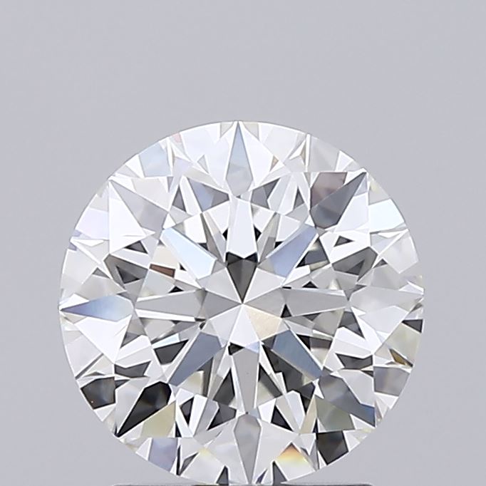 1.76 Close up of a round brilliant cut diamond against a grey background.