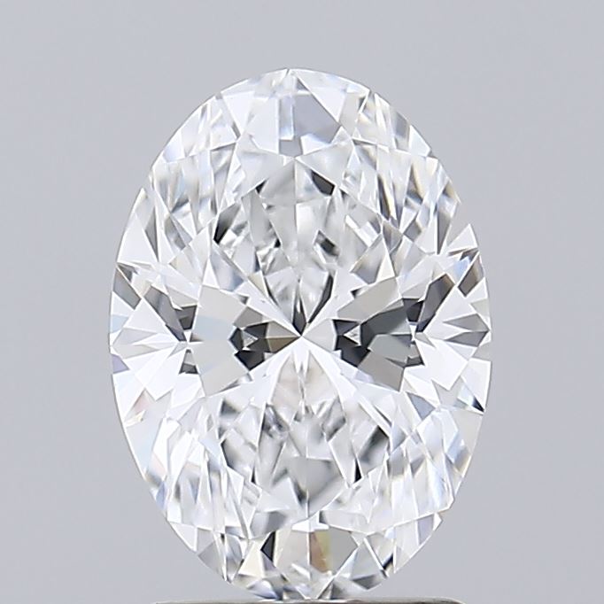 1.8 Close up of a sparkling oval cut diamond on a light background.