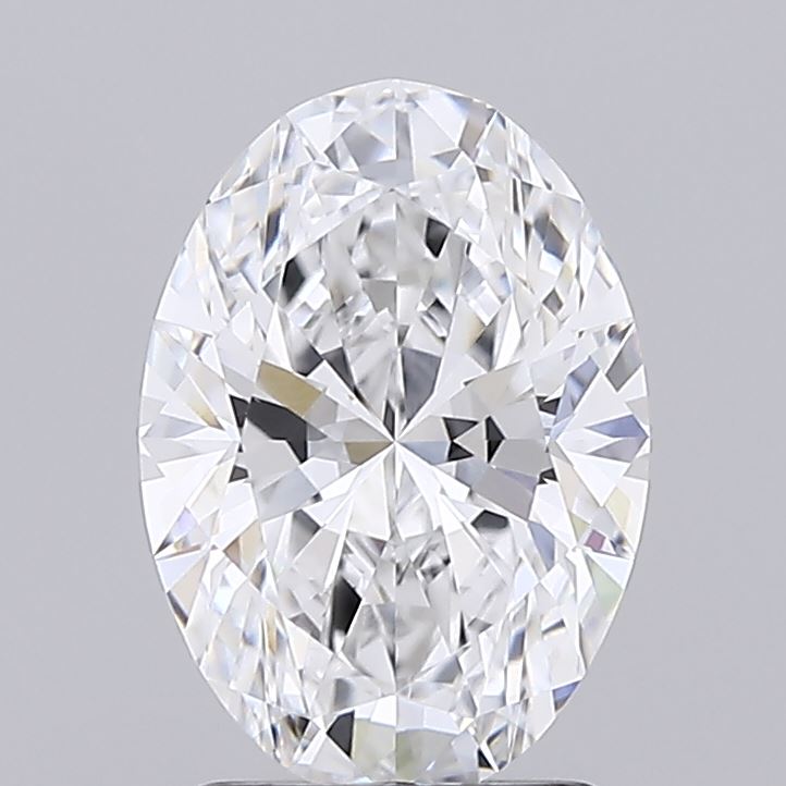1.84 An oval-cut diamond against a gray background, showcasing brilliant facets and a sparkling surface, conveying elegance and luxury.