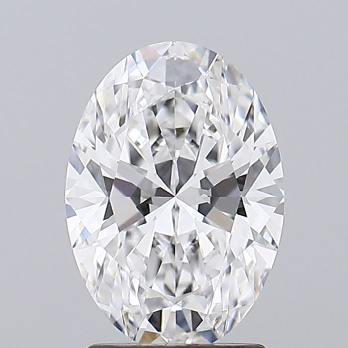 1.95 An exquisite oval-cut diamond sparkles brilliantly against a light gray background, showcasing its intricate facets and clarity.