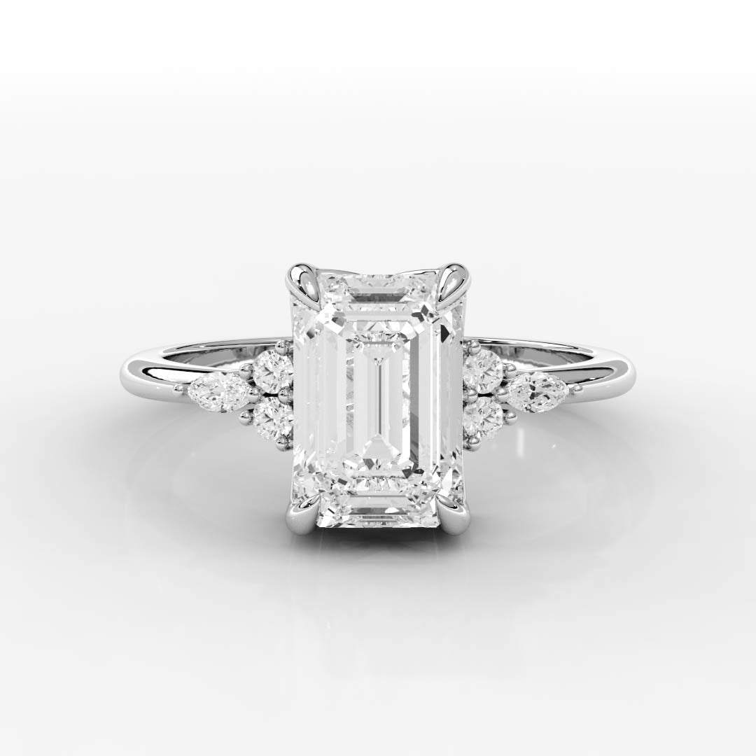 Triana Setting Engagement Ring featuring a large emerald-cut center stone with claw prong accents and lab grown diamond side stones on a sleek band