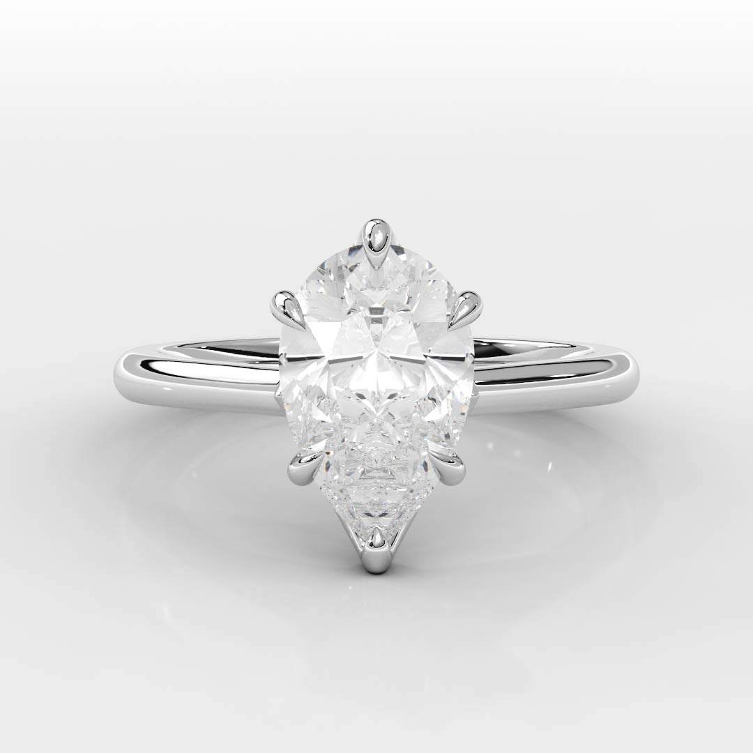 Tapered Cathedral Setting engagement ring with pear-shaped diamond and sleek platinum band, handcrafted in NYC diamond district for exclusive luxury and lasting brilliance