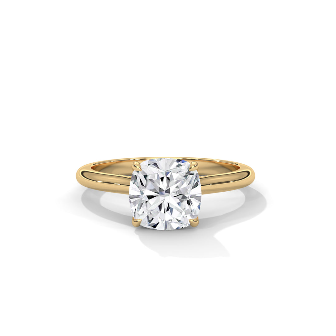 Gold ring with a large diamond on a white background
