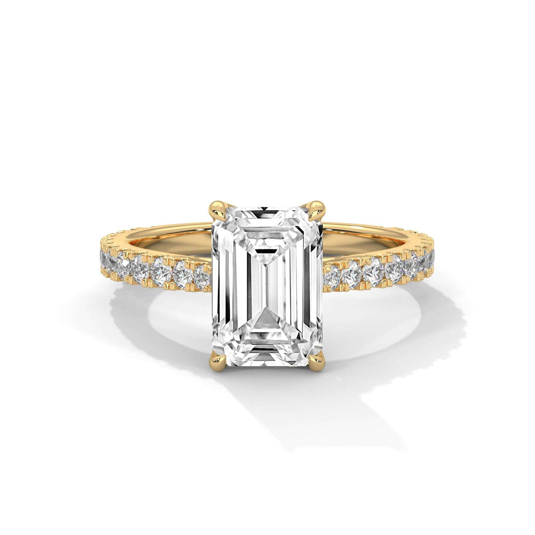 Étoile Tulip Setting engagement ring with emerald-cut diamond and pavé-set diamonds on a yellow gold band