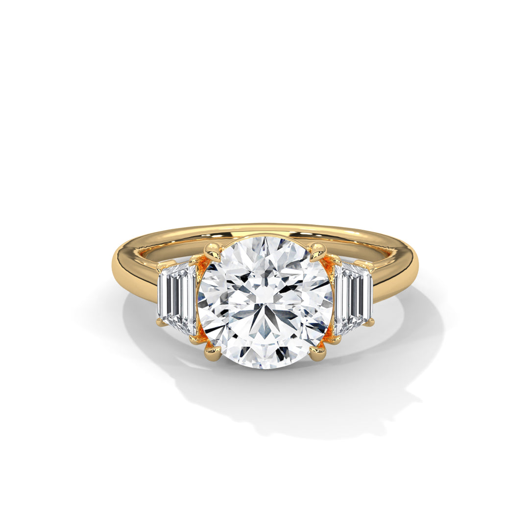 Gold ring with a large diamond and smaller baguette-cut diamonds on a white background