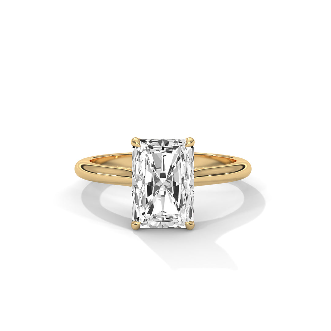 Gold ring with a large diamond on a white background