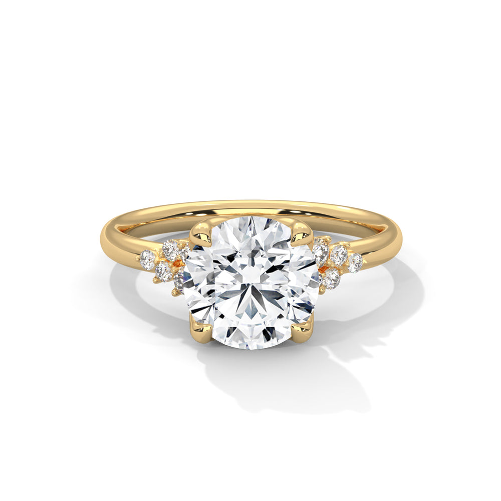 Gold ring with a large diamond and smaller diamonds on the sides against a white background