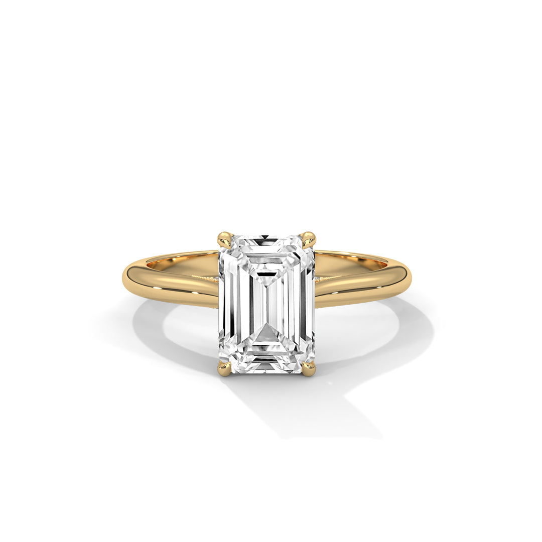 Gold ring with a large diamond on a white background