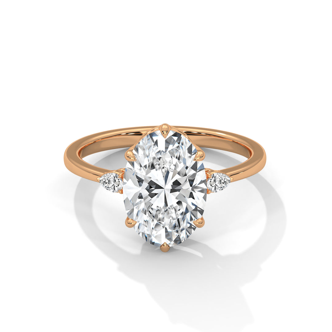 Rose gold ring with a large diamond and smaller diamonds on the sides against a white background