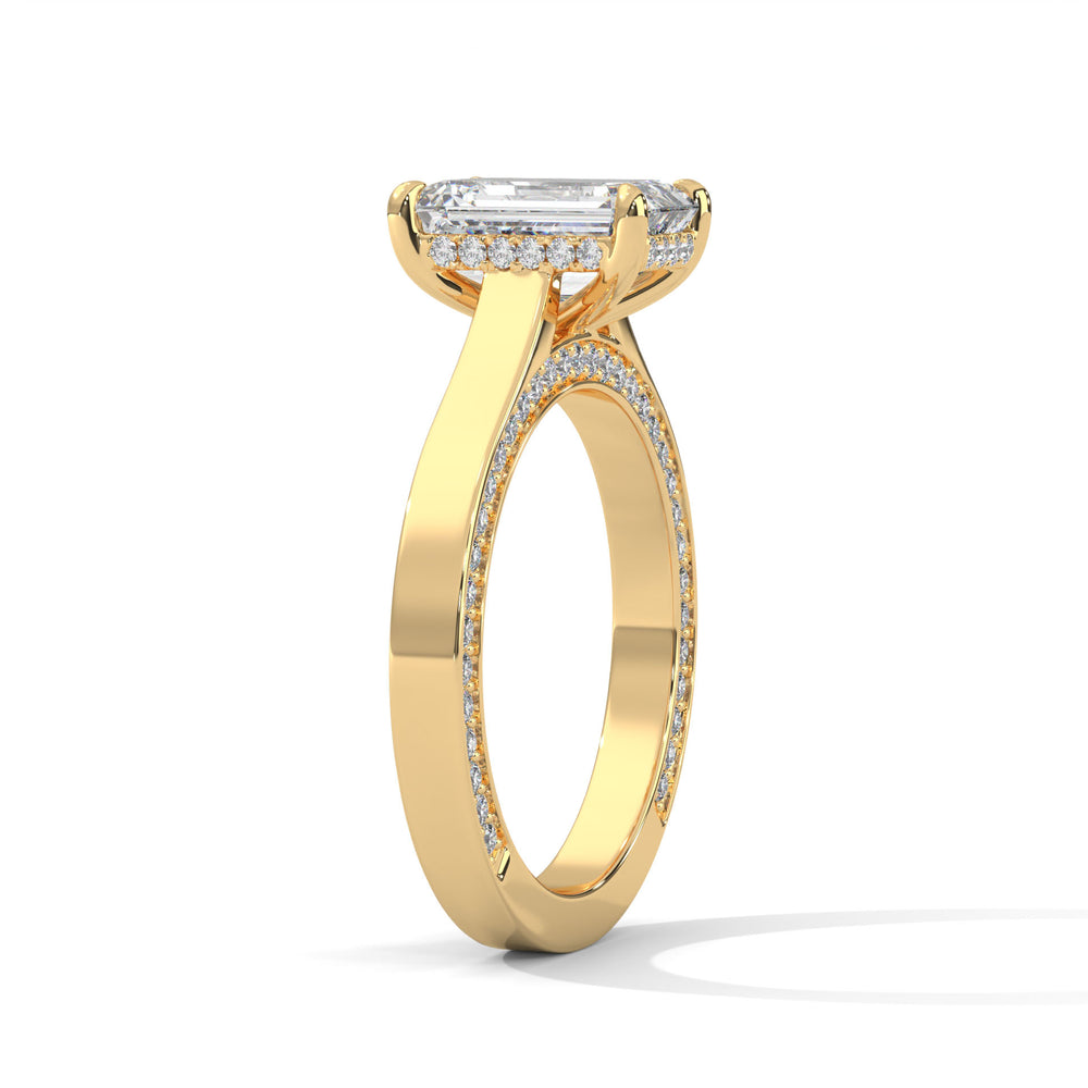 Gold ring with a diamond on a white background