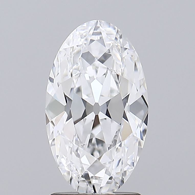 2.03 Oval-shaped diamond with intricate facets, reflecting light brilliantly. The gem is positioned against a neutral gray background, conveying elegance.