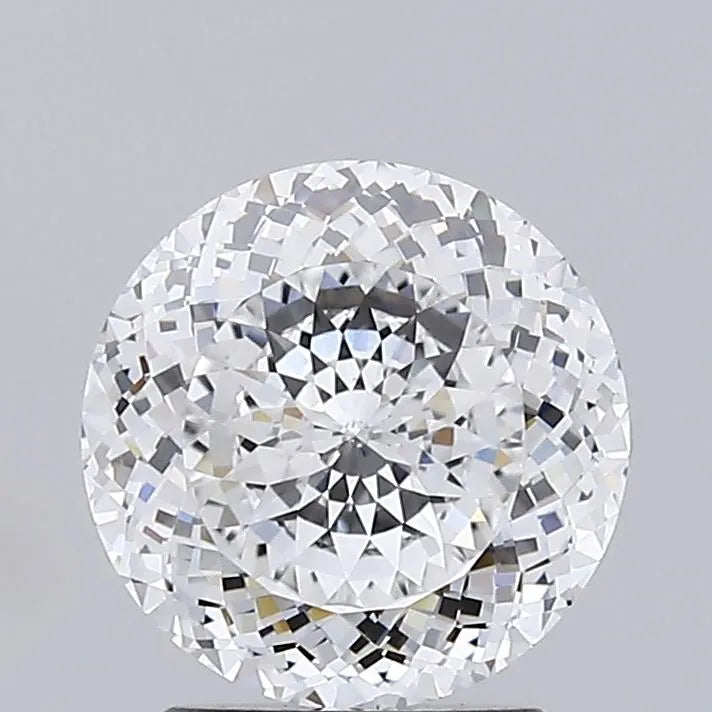 2.05 A close up of a sparkling round cut diamond against a grey background.