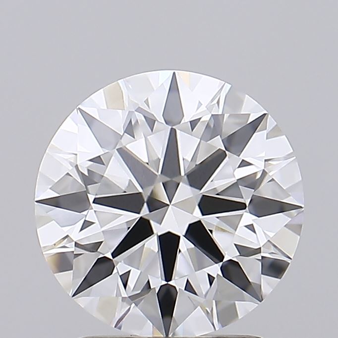 2.06 A round, brilliant-cut diamond on a gray background, showcasing symmetrical facets and sparkling reflections, conveying elegance and luxury.