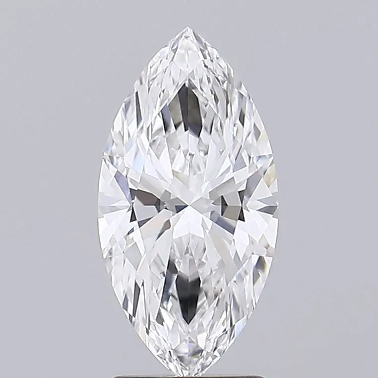 2.08 A close up of a sparkling marquise cut diamond against a grey background.