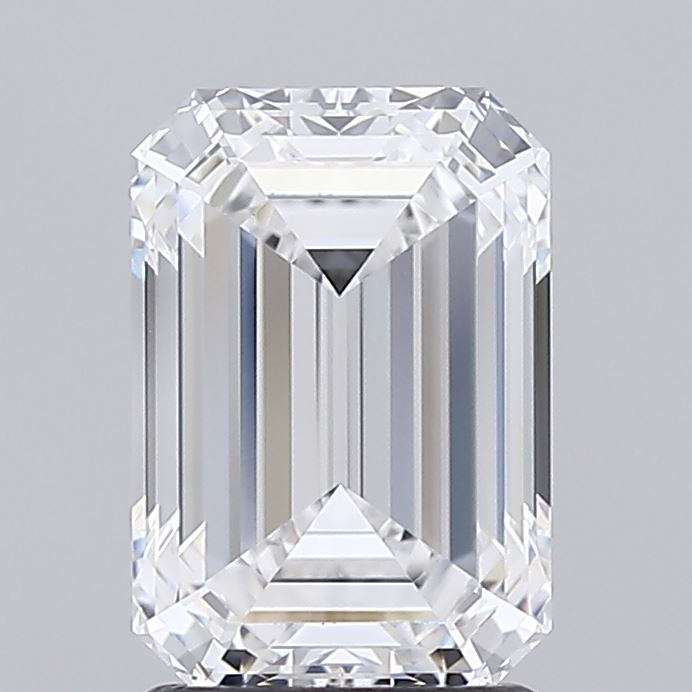 2.08 Emerald-cut diamond with sharp facets and clear reflections, set against a plain gray background, exuding elegance and timeless beauty.