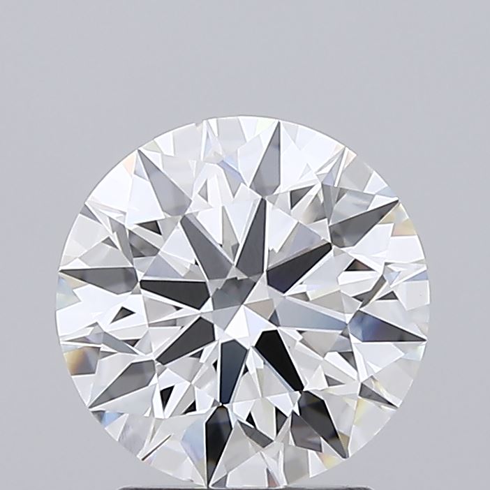 2.08 A round, brilliant-cut diamond showcasing precise facets and high clarity. The gem sparkles against a light gray background, exuding elegance and luxury.