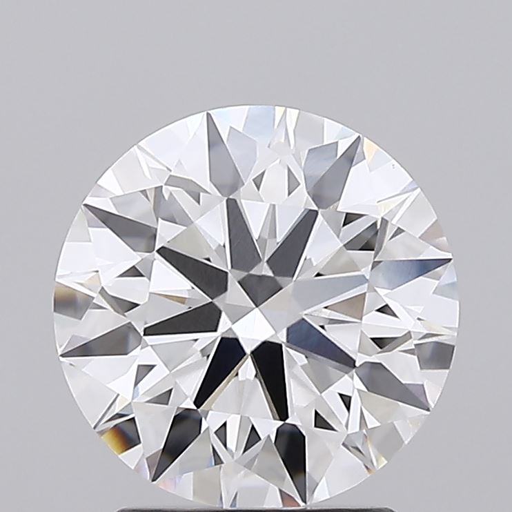 2.09 Close-up of a round, brilliant-cut diamond with dazzling facets reflecting light against a gray background.