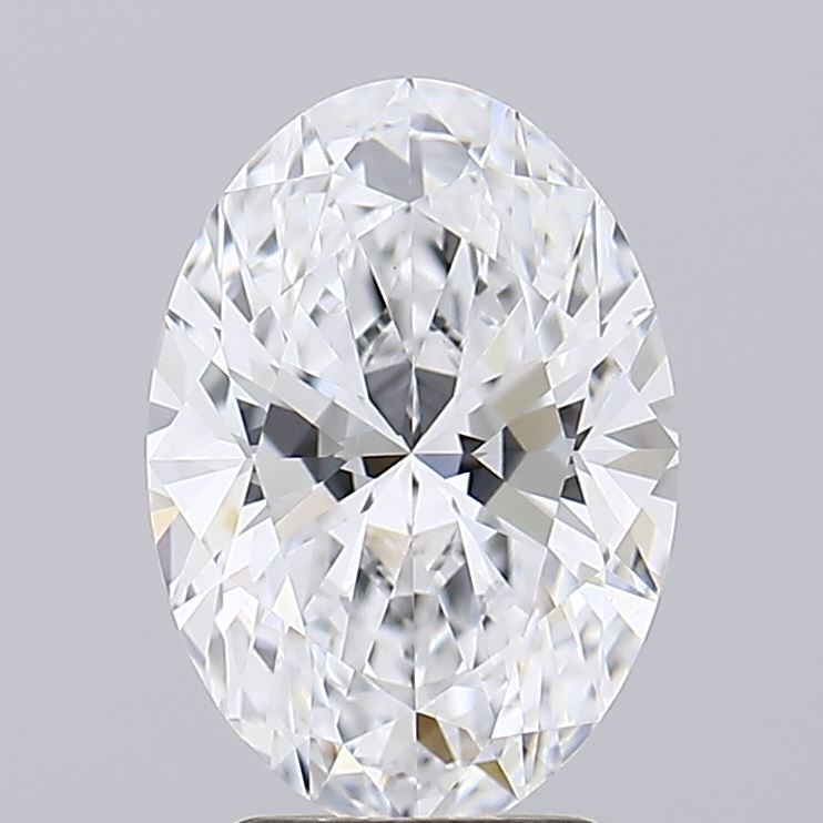 2.09 An oval-shaped, clear diamond with intricate facets reflecting light, set against a plain gray background, conveying elegance and brilliance.