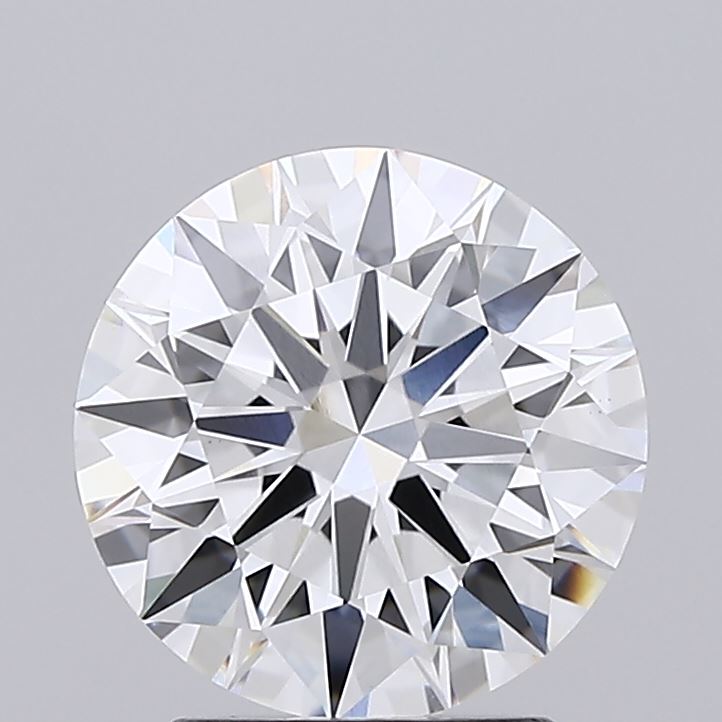 2.21 A close-up of a round, sparkling, brilliant-cut diamond, showcasing its intricate facets against a plain gray background, conveying luxury and elegance.