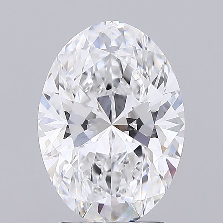 2.22 Oval-shaped diamond with brilliant facets reflecting light, set against a plain grey background, exuding elegance and luxury.