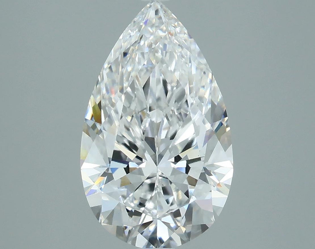 2.25 A close-up of a sparkling pear-shaped diamond against a gray background. The facets create a dazzling display of light, conveying elegance and luxury.
