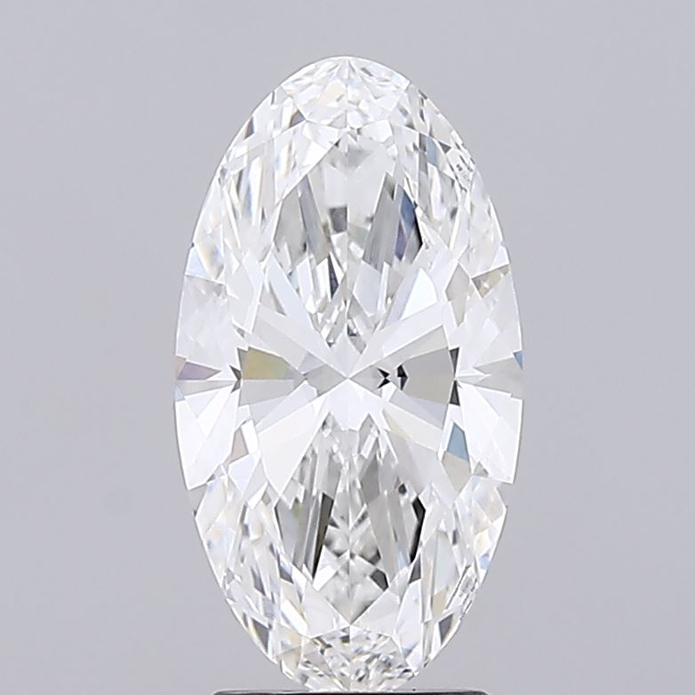 2.5 An oval-cut diamond against a plain gray background. The diamond sparkles with facets reflecting light, showcasing clarity and brilliance.