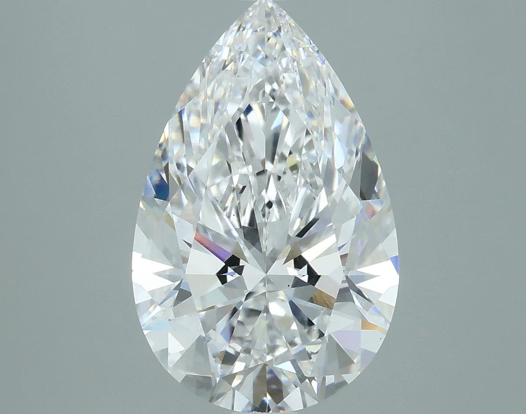 2.54 A brilliant pear-shaped diamond, showcasing a stunning array of facets that reflect light and sparkle elegantly against a gray background.