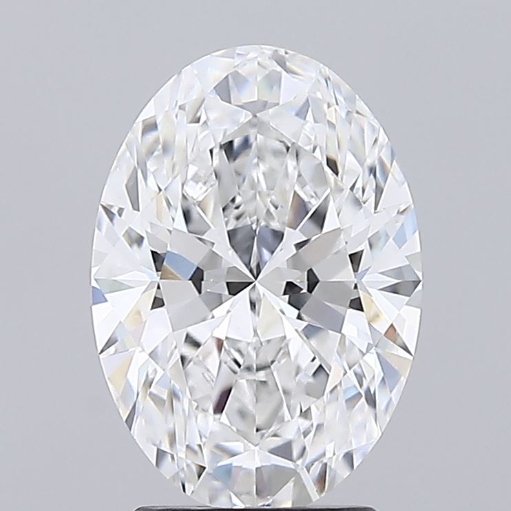 2.54 Oval-cut diamond with brilliant facets reflecting various light shades, set against a plain gray background. The gem conveys luxury and elegance.