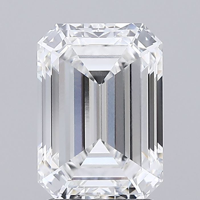 2.56 Emerald-cut diamond with sharp facets and a rectangular shape, reflecting light brilliantly. Set against a neutral gray background, it conveys elegance.