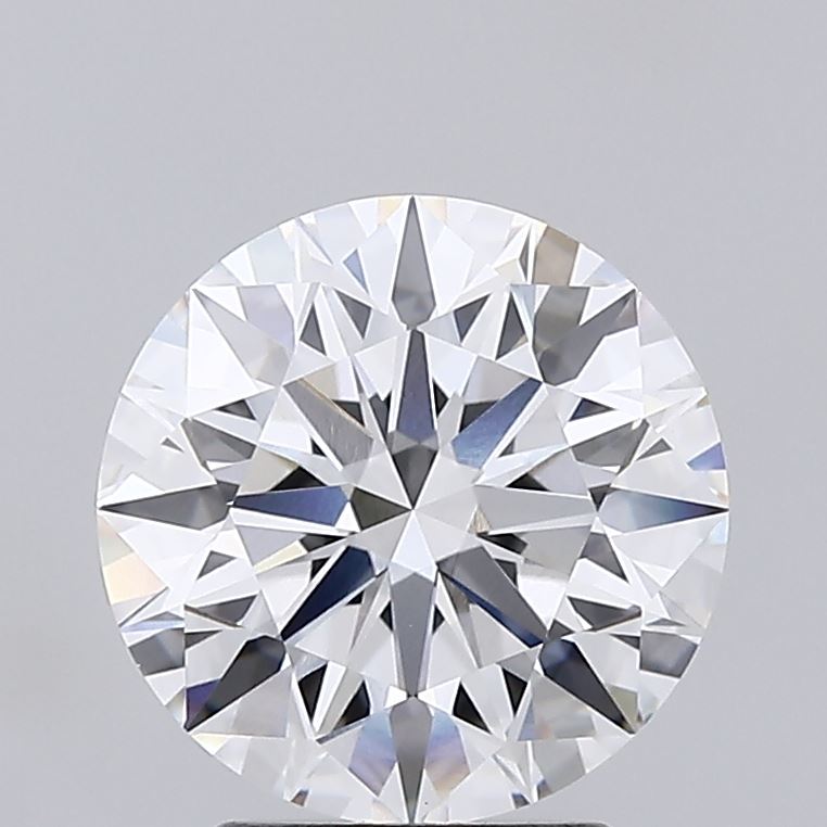 2.56 Round brilliant cut diamond with multiple facets reflecting light against a gray background.