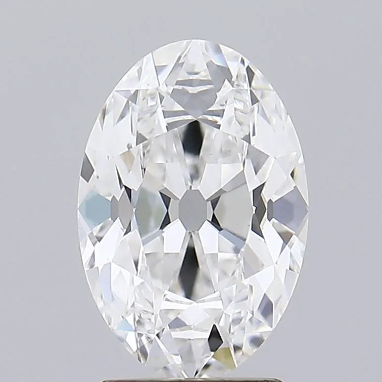 2.57 A close up of a sparkling oval cut diamond against a grey background.