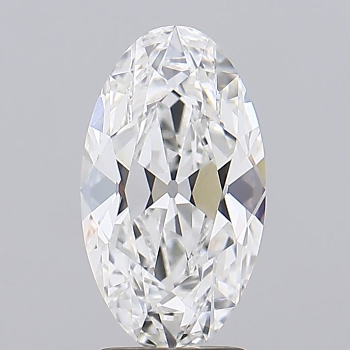 2.7 Oval-cut diamond with intricate facets, reflecting light to create a sparkling effect against a soft gray background. The gem exudes elegance and luxury.