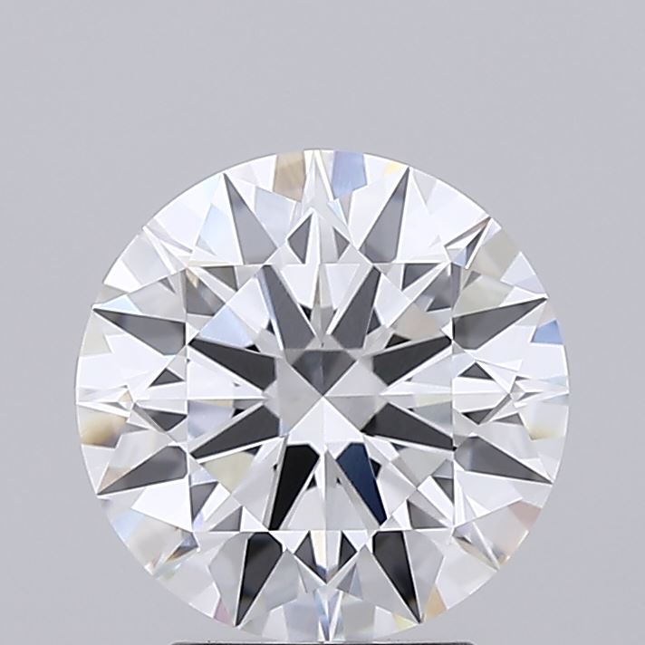 2.71 Close-up of a round diamond against a grey background, showcasing its brilliant cut with numerous facets reflecting light, conveying elegance and luxury.