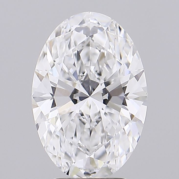 2.71 Oval-shaped diamond with intricate facets reflecting light, creating a dazzling sparkle. Set against a plain gray background, it exudes elegance and luxury.