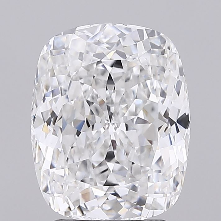 2.74 A brilliant, cushion-cut diamond sparkles with numerous facets, showcasing its clarity and reflective brilliance against a gray backdrop.