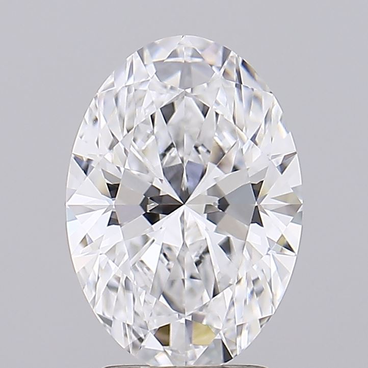 2.75 An elegant, oval-cut diamond glistening with brilliance, showcasing intricate facets and a clear, vibrant sparkle against a neutral backdrop.