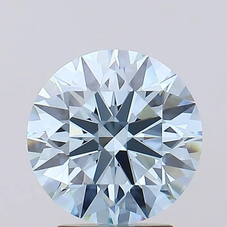 2.75 Sparkling round brilliant diamond with numerous facets reflecting light set against a soft grey background.