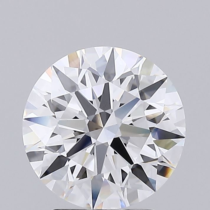 2.77 A brilliant-cut diamond sparkles against a gray background. Its facets reflect subtle hues of blue, orange, and yellow, conveying elegance and luxury.