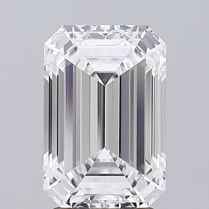 2.85 Rectangular emerald-cut diamond with clear facets, reflecting light on a gray background. Conveys elegance and luxury.