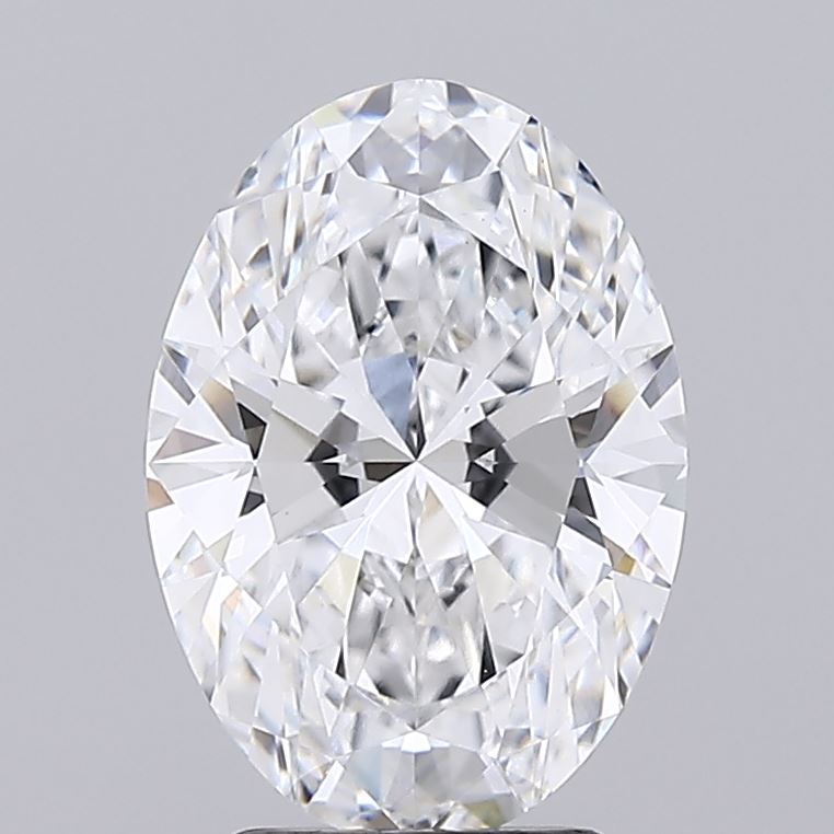 2.89 Oval-shaped diamond against a gray background, showcasing intricate facets that sparkle with a range of colors, conveying elegance and brilliance.